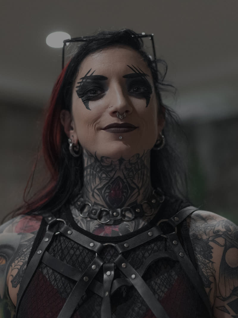 Portrait in a leather harness, hotel light behind